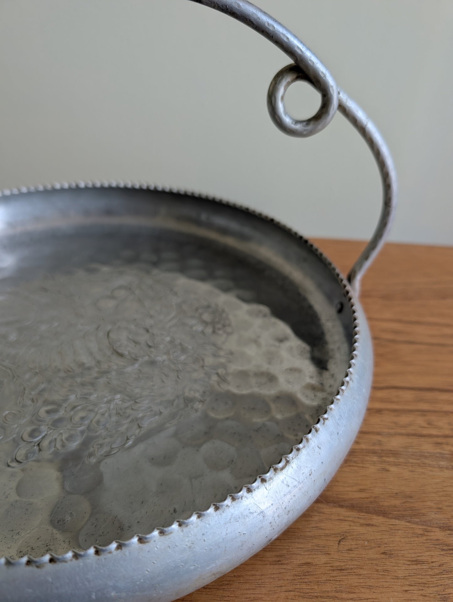 Cromwell Hammered Aluminum Round Basket with Handle Featuring a Cornucopia