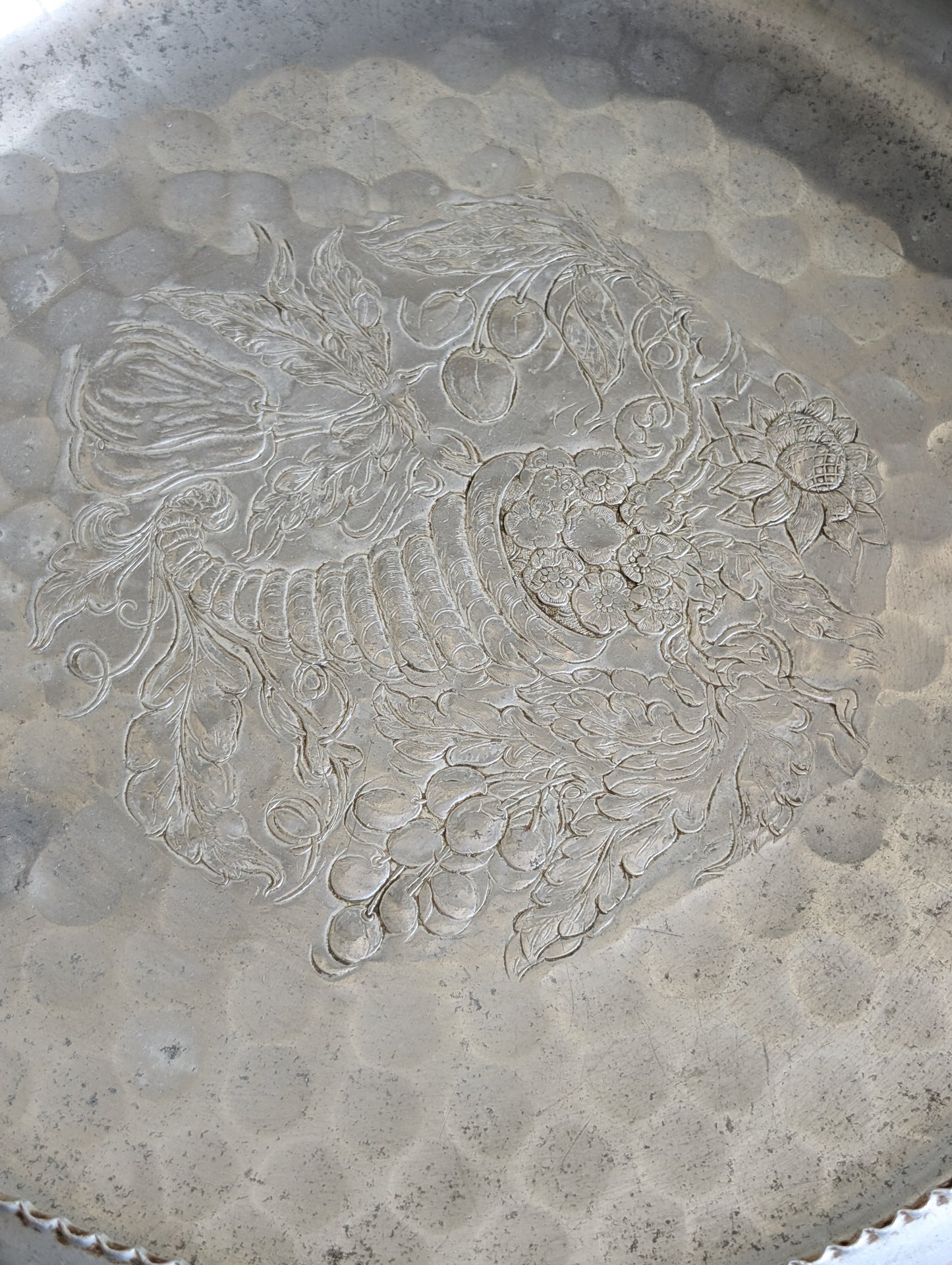 Cromwell Hammered Aluminum Round Basket with Handle Featuring a Cornucopia