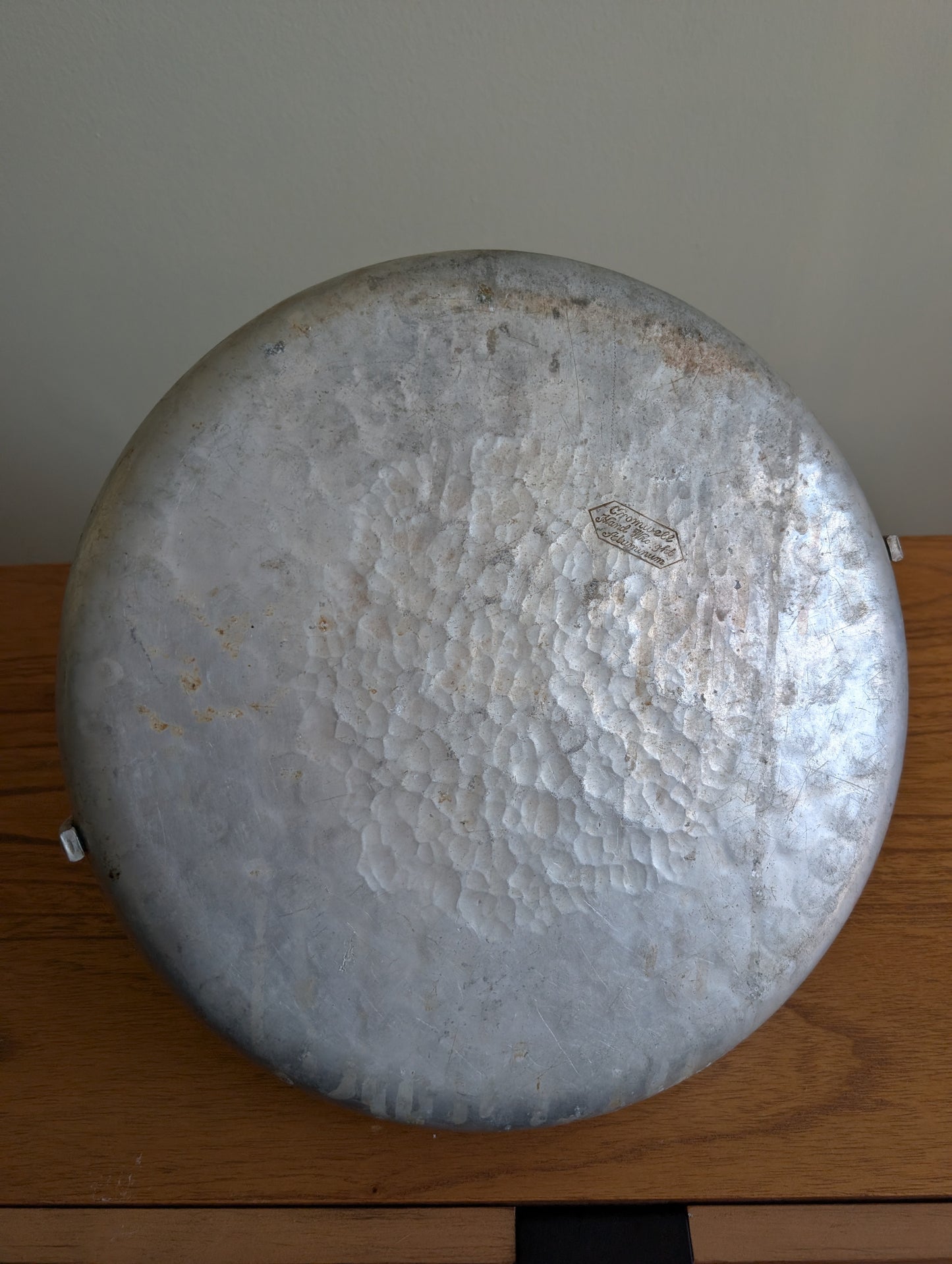 Cromwell Hammered Aluminum Round Basket with Handle Featuring a Cornucopia