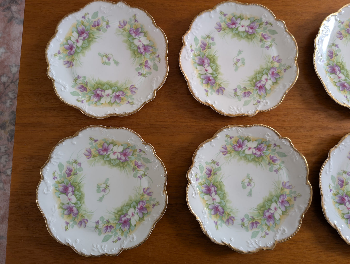 Set of 8 Limoges Coronet 8 inch Plates featuring Scalloped Gold Rims and Transferware Pansies