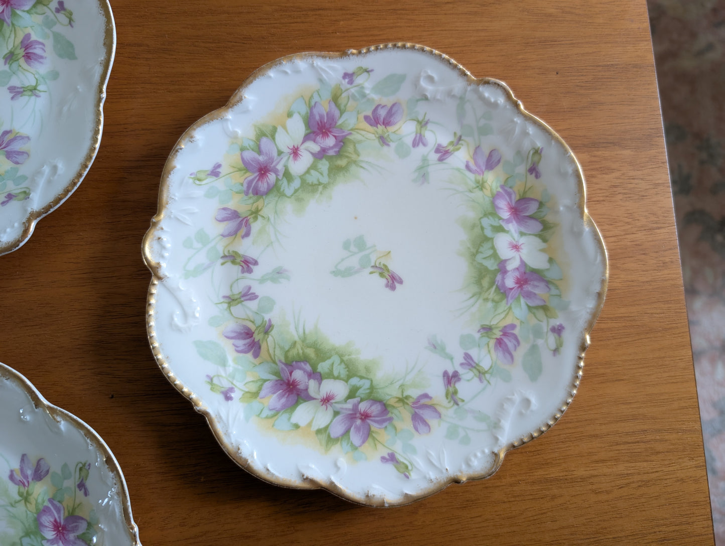 Set of 8 Limoges Coronet 8 inch Plates featuring Scalloped Gold Rims and Transferware Pansies