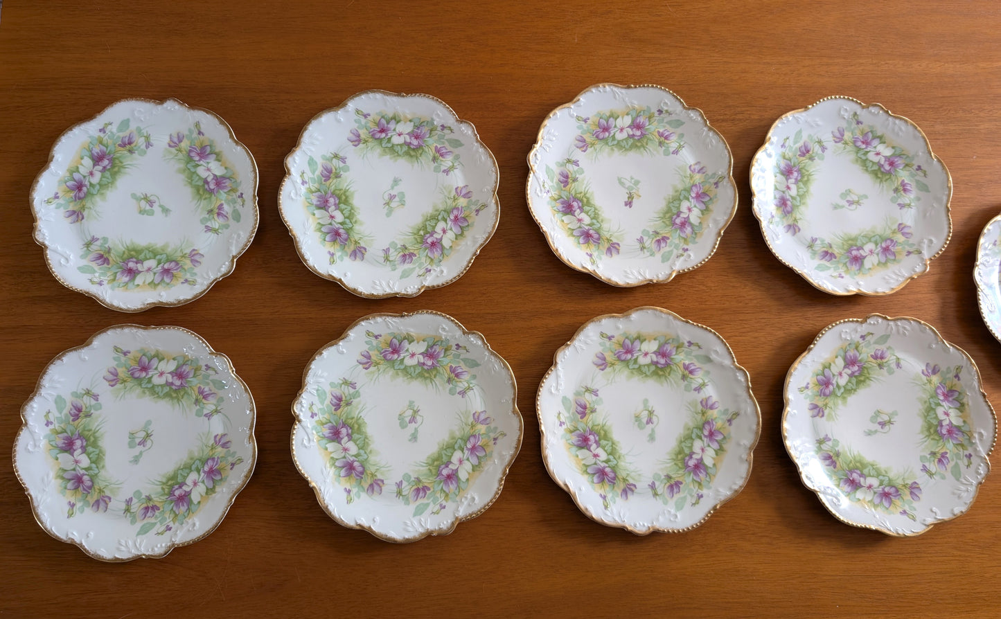 Set of 8 Limoges Coronet 8 inch Plates featuring Scalloped Gold Rims and Transferware Pansies