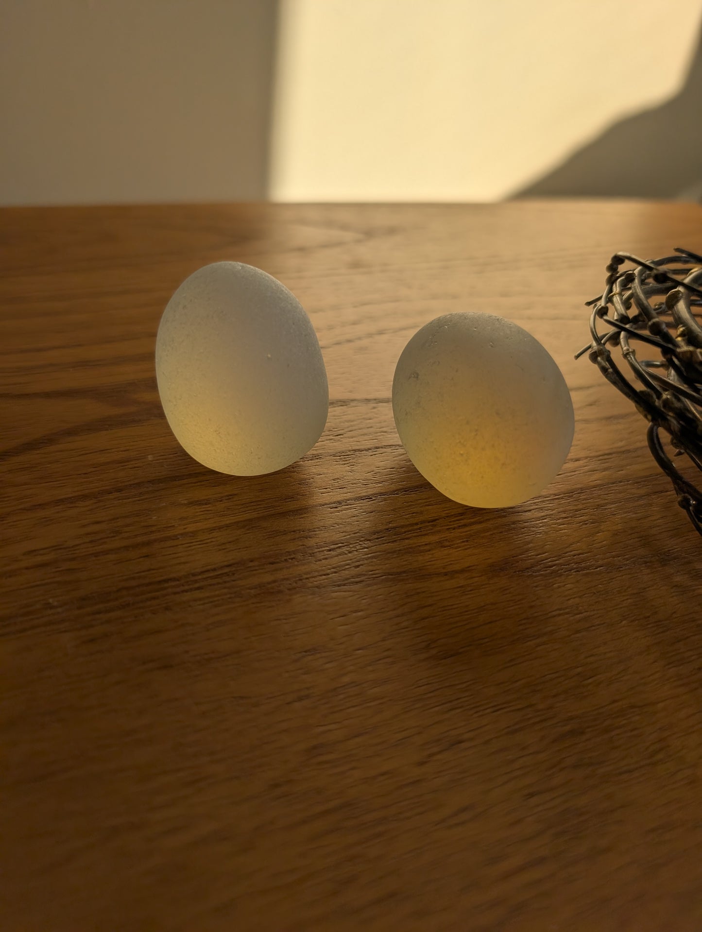 Glass or Stone Eggs in a Metal Nest
