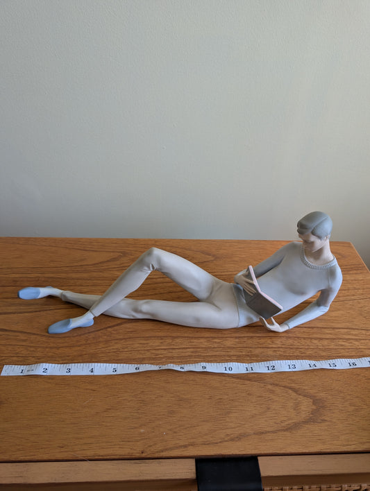Lladro Boy Reclining With a Book